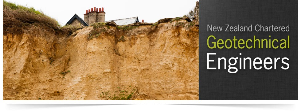 House perched at the top of an eroded, slumping cliff face — New Zealand Chartered Geotechnical Engineers